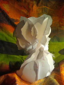 A Paper sculpture printed out from sections of the 3D Model of the bust of the fountain of Asgard. 